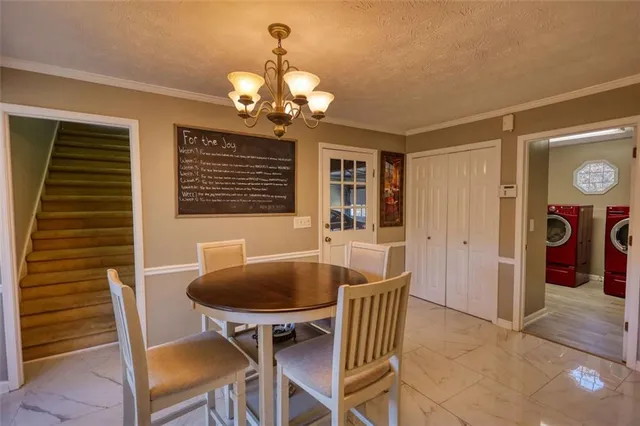 a bathroom with a granite countertop toilet a sink and mirror