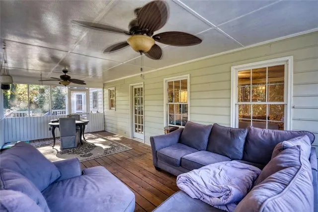a bedroom with a large bed and a flat tv screen on dresser