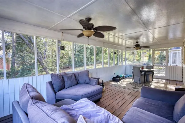 a bedroom with a bed window and a desk