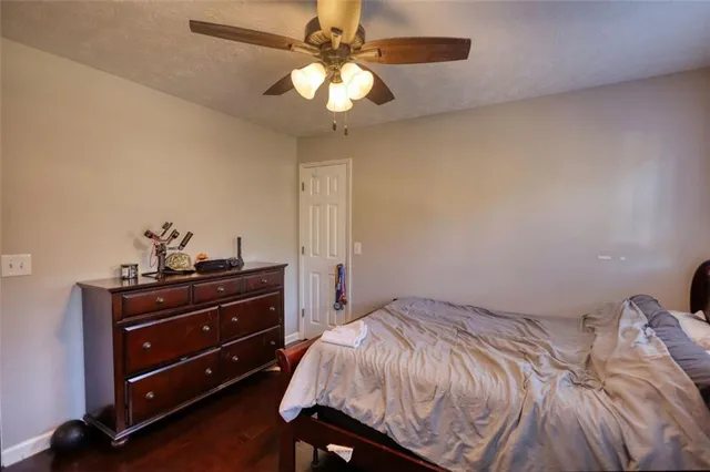 a bed room with a bed and a chandelier