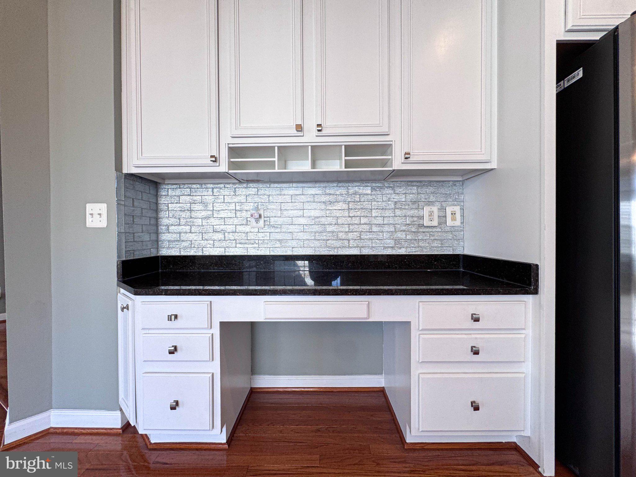 22827 Oakgrove Road Sterling, VA 20166 - Photo 38 of 56 Sleek kitchen workspace with elegance.