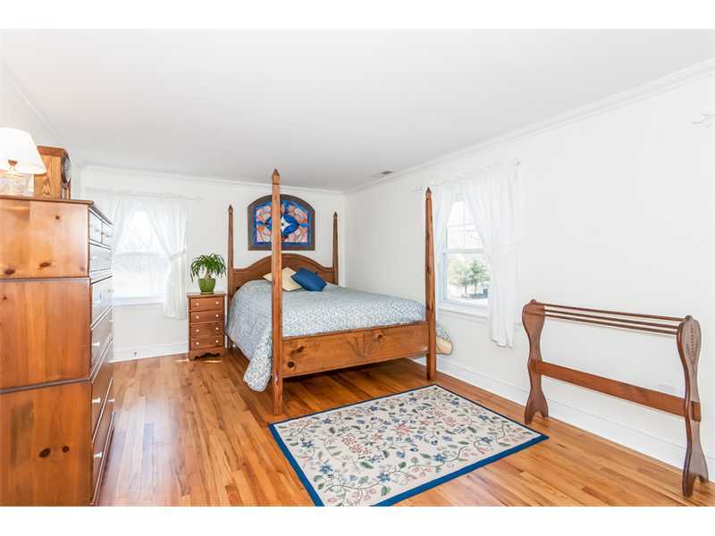65 Lockwood Lane Riverside, CT 06878 - Photo 16 of 25 a bedroom with furniture and a wooden floor