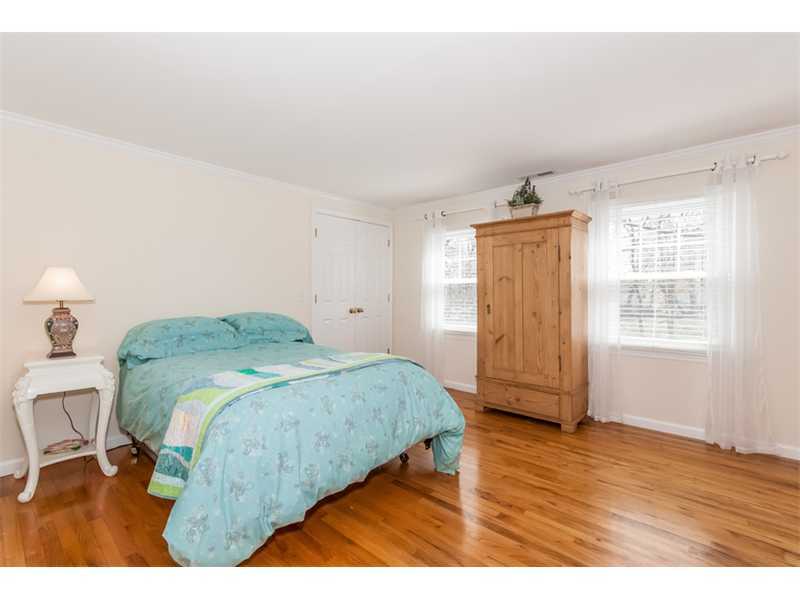 65 Lockwood Lane Riverside, CT 06878 - Photo 17 of 25 a bedroom with a bed and a window