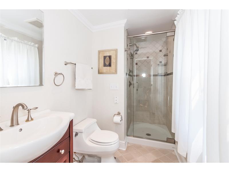 65 Lockwood Lane Riverside, CT 06878 - Photo 18 of 25 a bathroom with a shower sink mirror and toilet