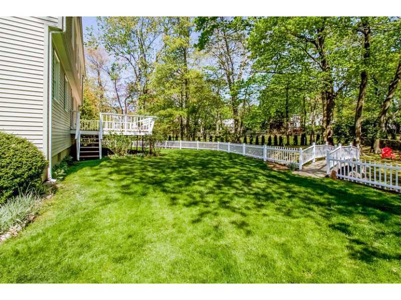 65 Lockwood Lane Riverside, CT 06878 - Photo 21 of 25 a view of a backyard with a garden