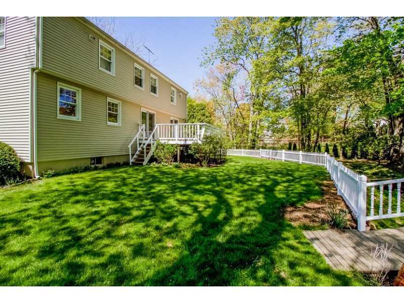 65 Lockwood Lane Riverside, CT 06878 - Photo 24 of 25 a front view of a house with garden