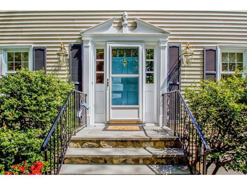 65 Lockwood Lane Riverside, CT 06878 - Photo 25 of 25 a front view of a house with a yard