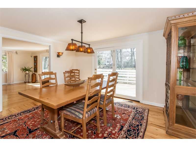 65 Lockwood Lane Riverside, CT 06878 - Photo 7 of 25 a view of a dining room and livingroom with furniture wooden floor a chandelier