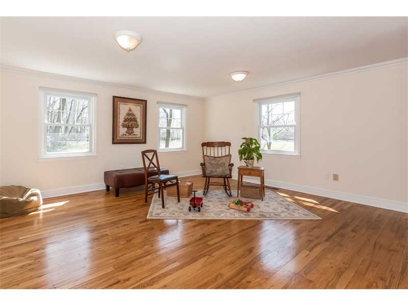 65 Lockwood Lane Riverside, CT 06878 - Photo 8 of 25 a living room with furniture and a wooden floor