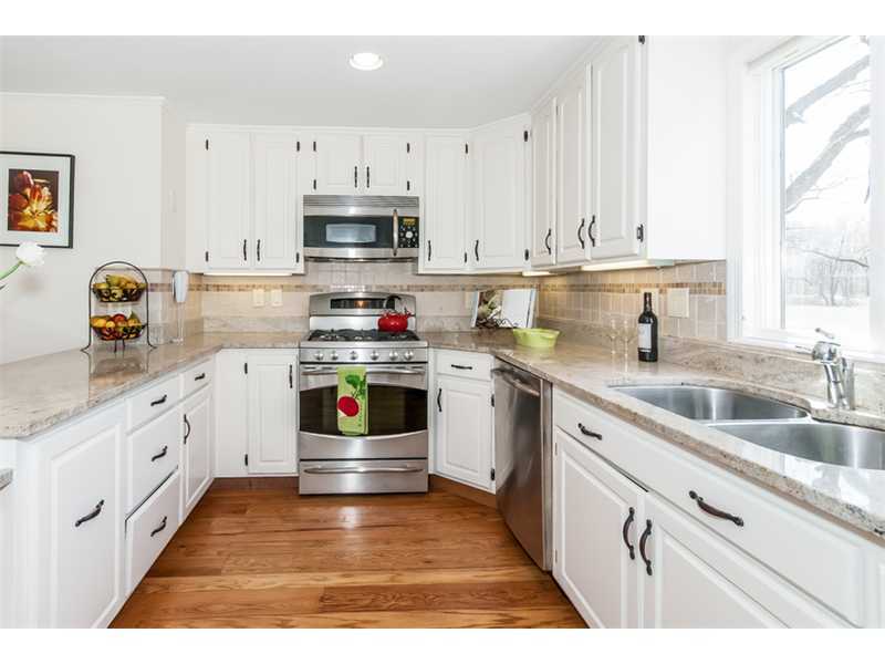65 Lockwood Lane Riverside, CT 06878 - Photo 10 of 25 a kitchen with stainless steel appliances granite countertop a sink and cabinets