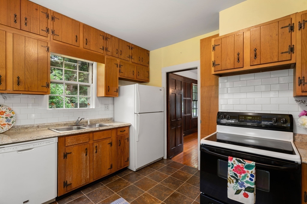 81 Avalon Road Newton, MA 02468 - Photo 13 of 38 a kitchen with stainless steel appliances granite countertop a refrigerator and a sink