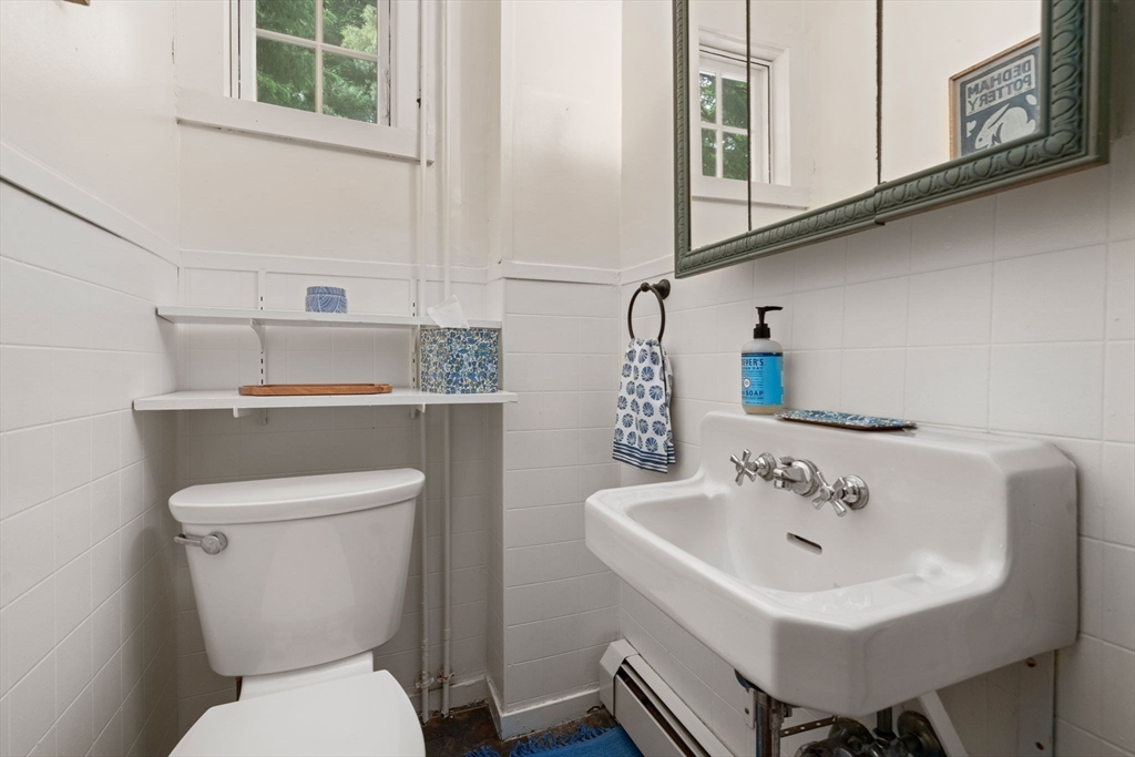 81 Avalon Road Newton, MA 02468 - Photo 15 of 38 a bathroom with a toilet sink and mirror