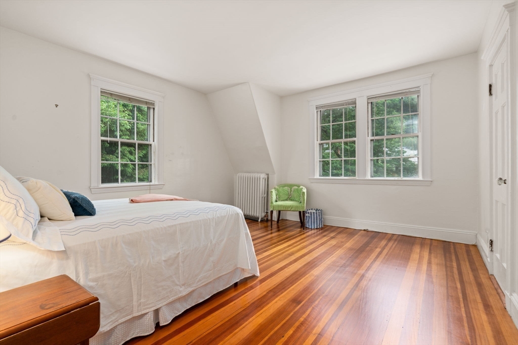 81 Avalon Road Newton, MA 02468 - Photo 21 of 38 a bedroom with a bed and wooden floor