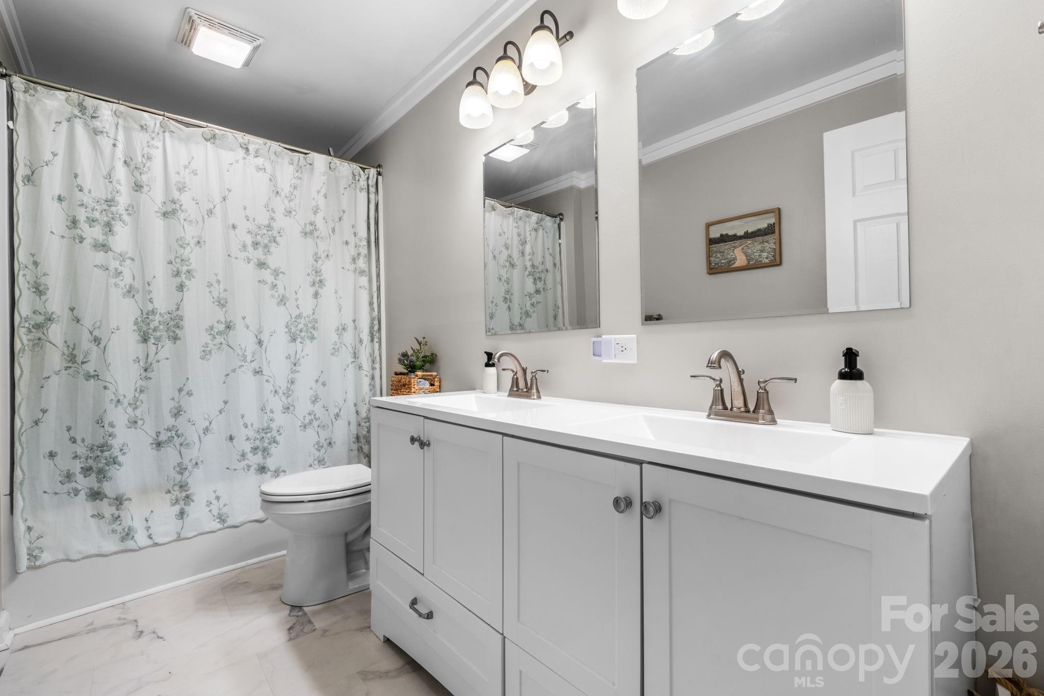 3941 Springs Road Northeast Conover, NC 28613 - Photo 16 of 21 a bathroom with a toilet sink and mirror