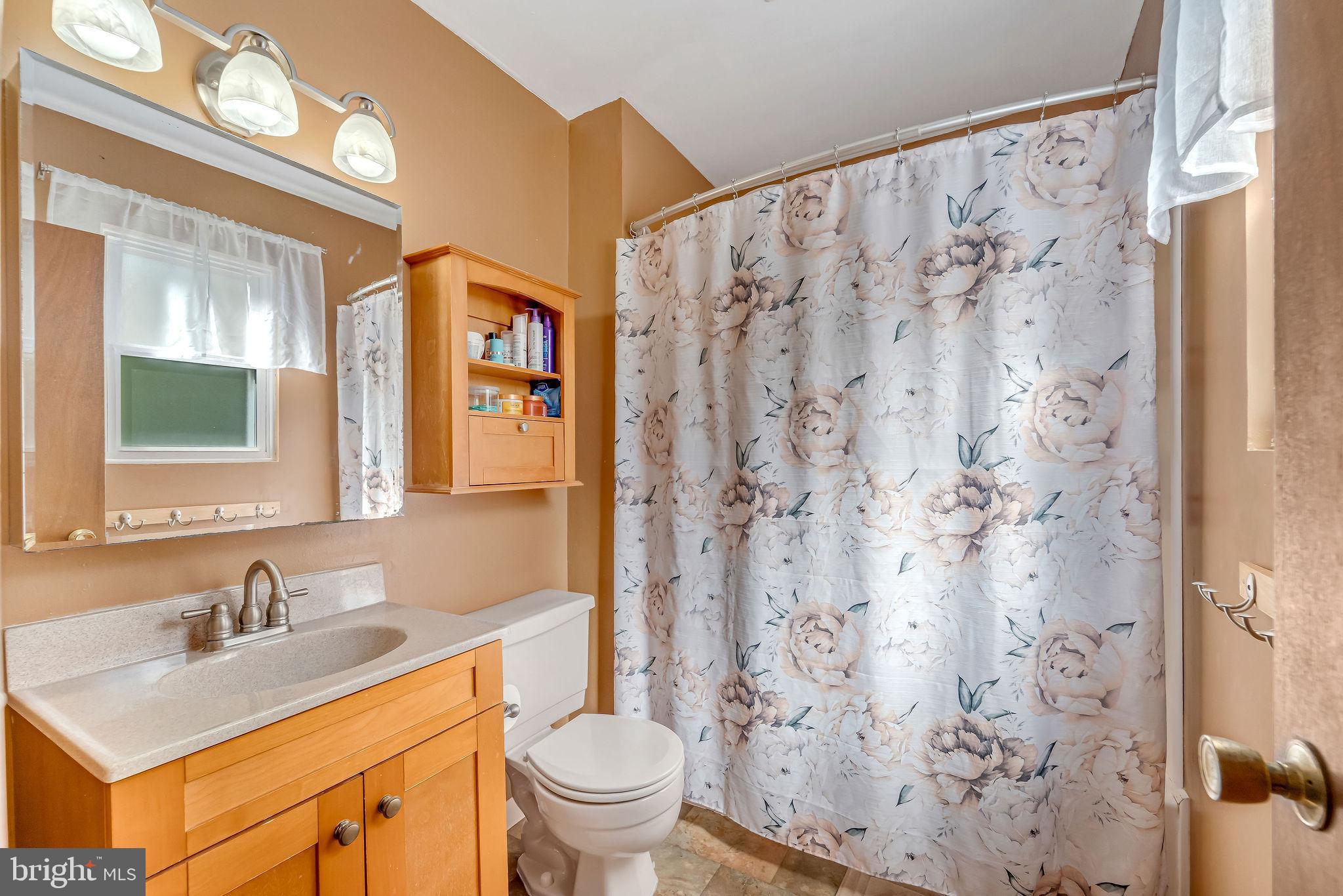 301 North Coles Avenue Maple Shade, NJ 08052 - Photo 20 of 31 a bathroom with a sink toilet and a mirror