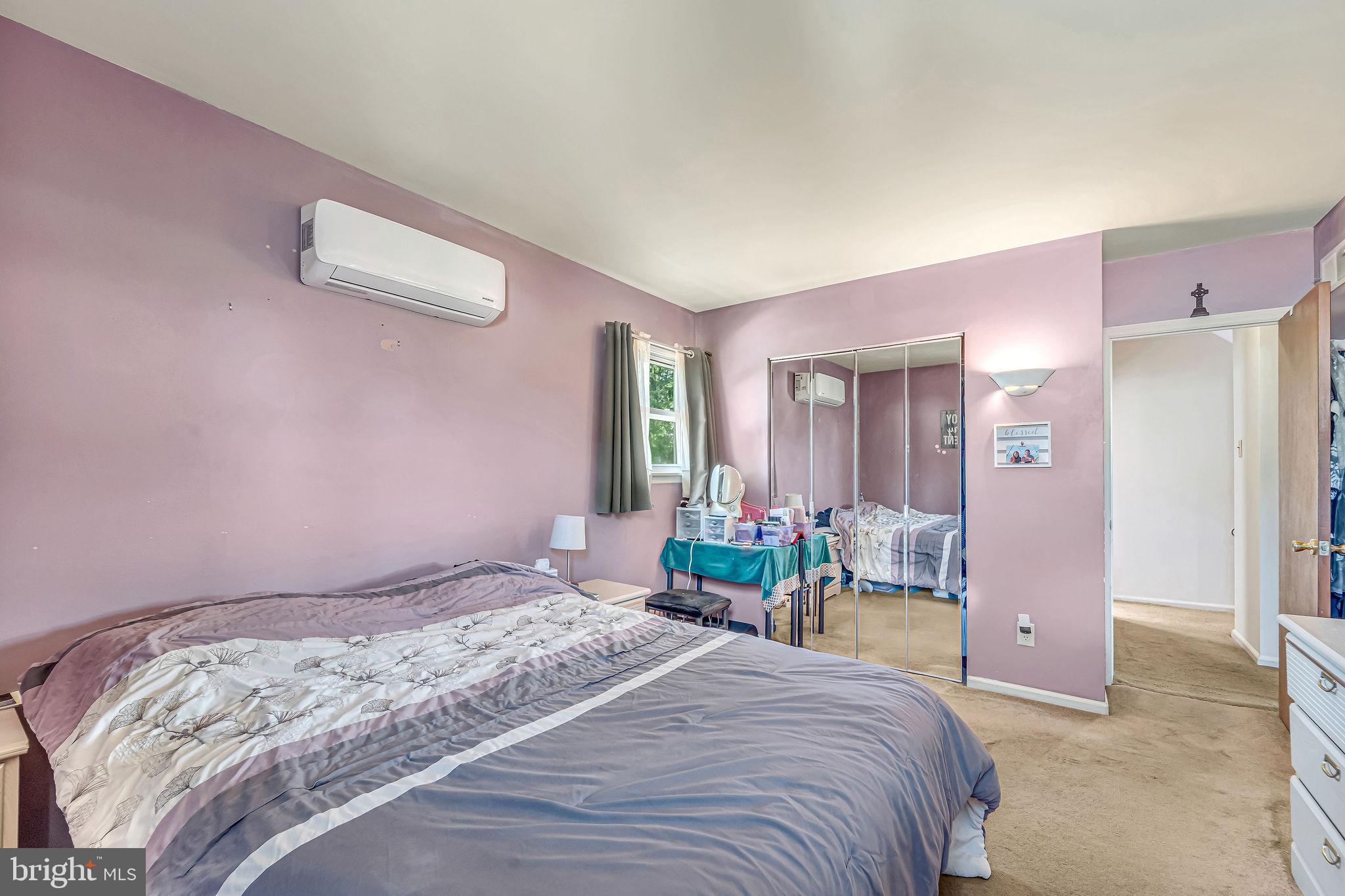301 North Coles Avenue Maple Shade, NJ 08052 - Photo 24 of 31 a bedroom with a bed and chandelier