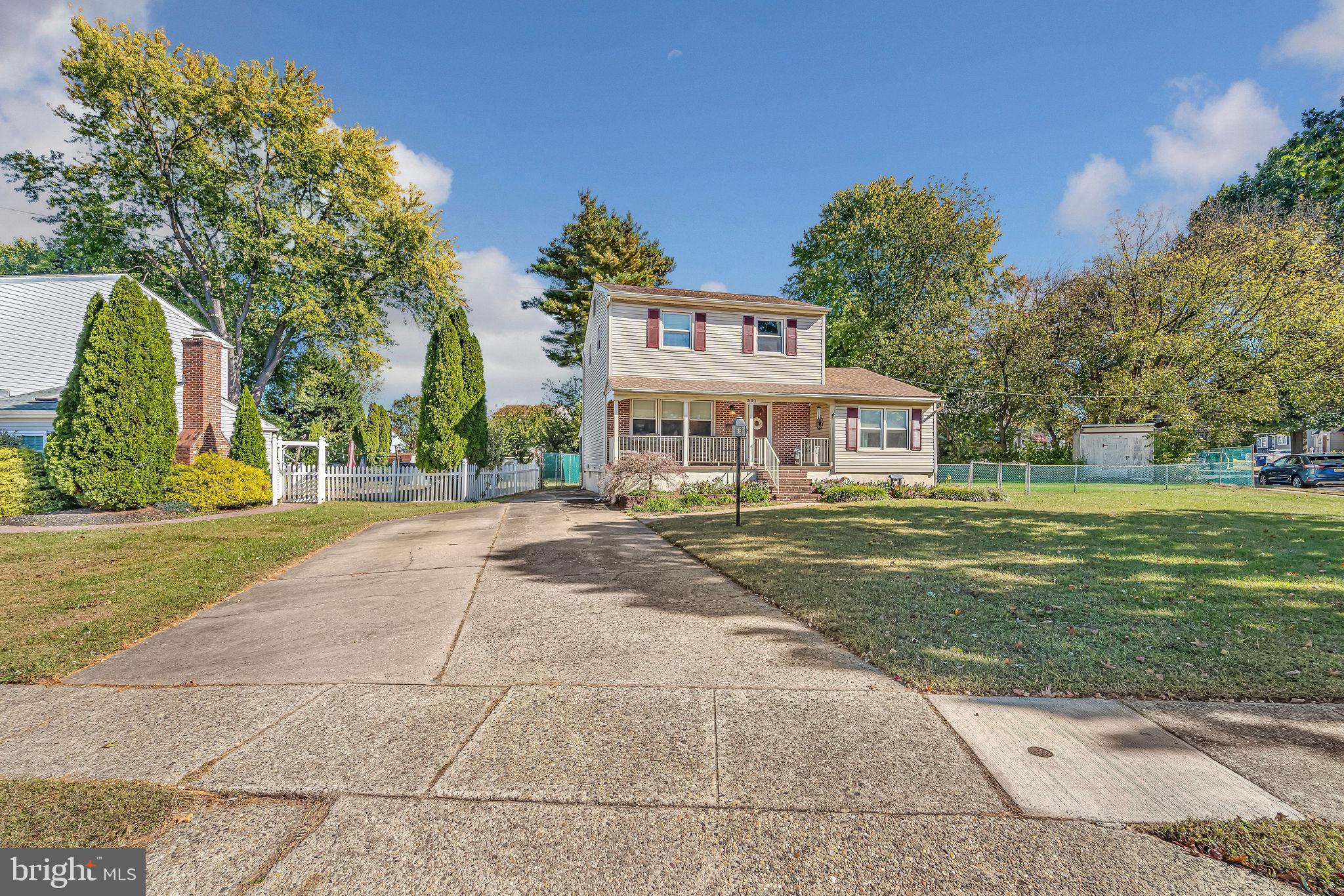 301 North Coles Avenue Maple Shade, NJ 08052 - Photo 3 of 31 a front view of a building with a garden