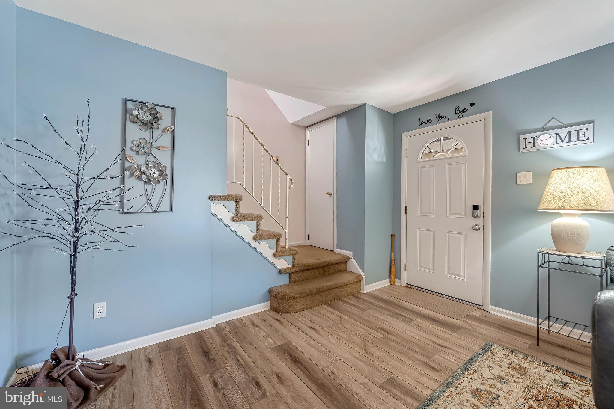 301 North Coles Avenue Maple Shade, NJ 08052 - Photo 6 of 31 a view of a hallway with wooden floor and stairs
