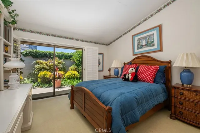 a bedroom with a large bed and a large window