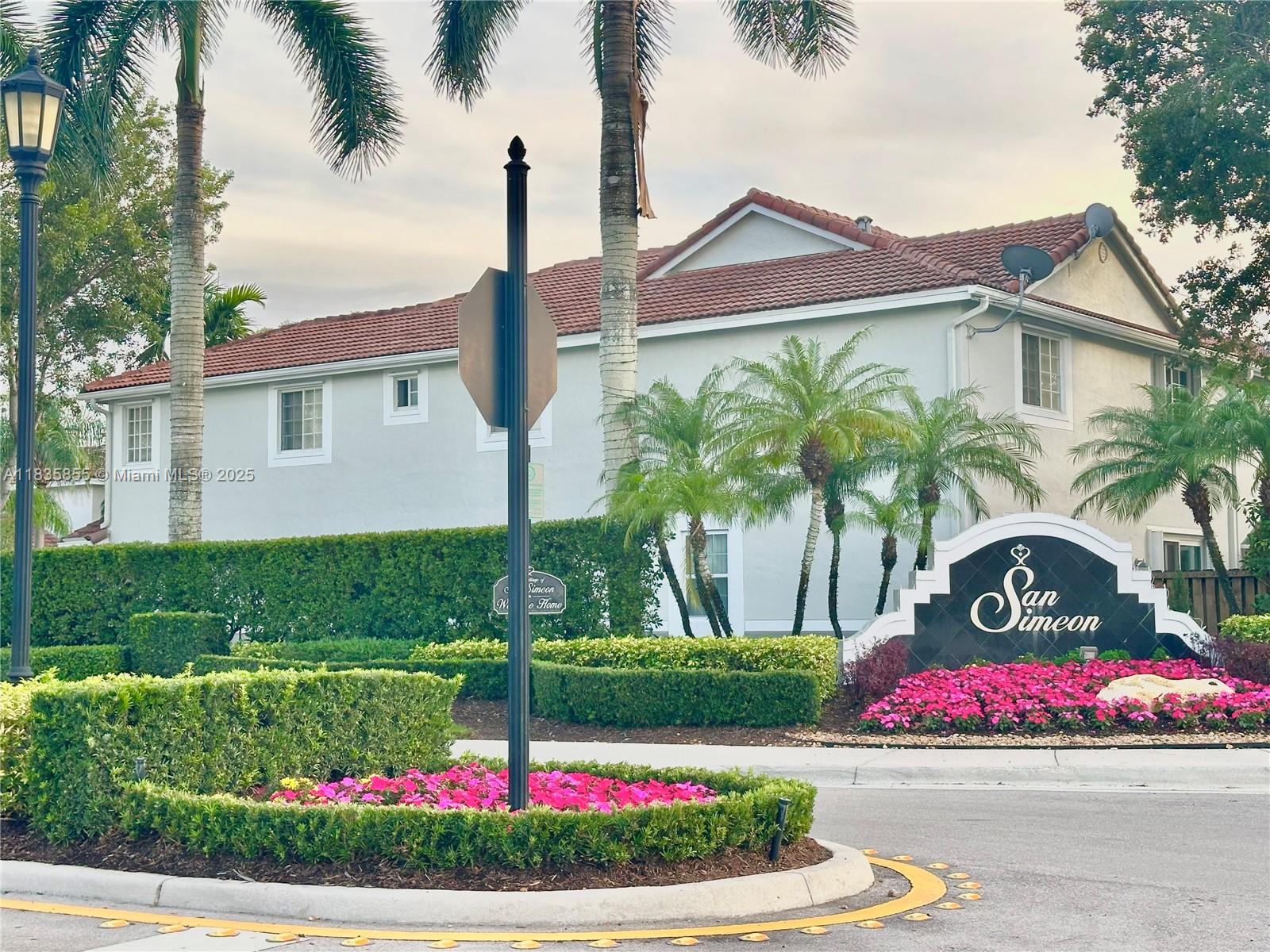 The Ridges Weston, FL 33331 - Photo 1 of 54 a front view of a house with a garden and pathway