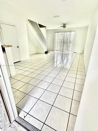 a kitchen with a sink and a refrigerator