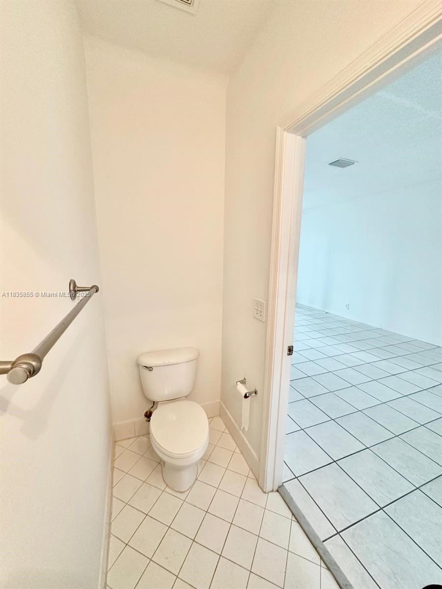 The Ridges Weston, FL 33331 - Photo 18 of 54 a bathroom with a toilet and a shower