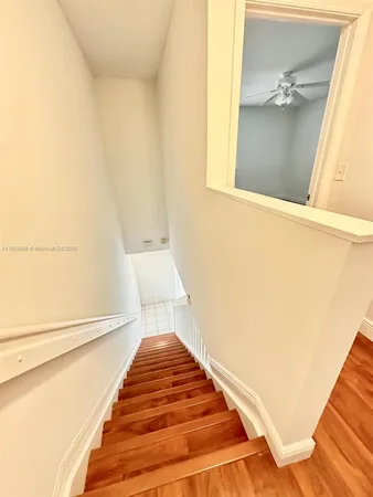 a bathroom with a white bath tub and a shower curtain