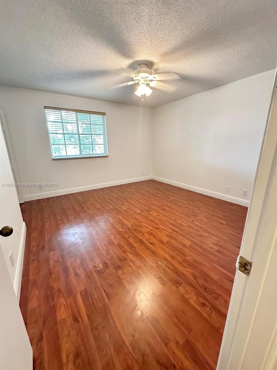 The Ridges Weston, FL 33331 - Photo 28 of 54 wooden floor in an empty room with a window
