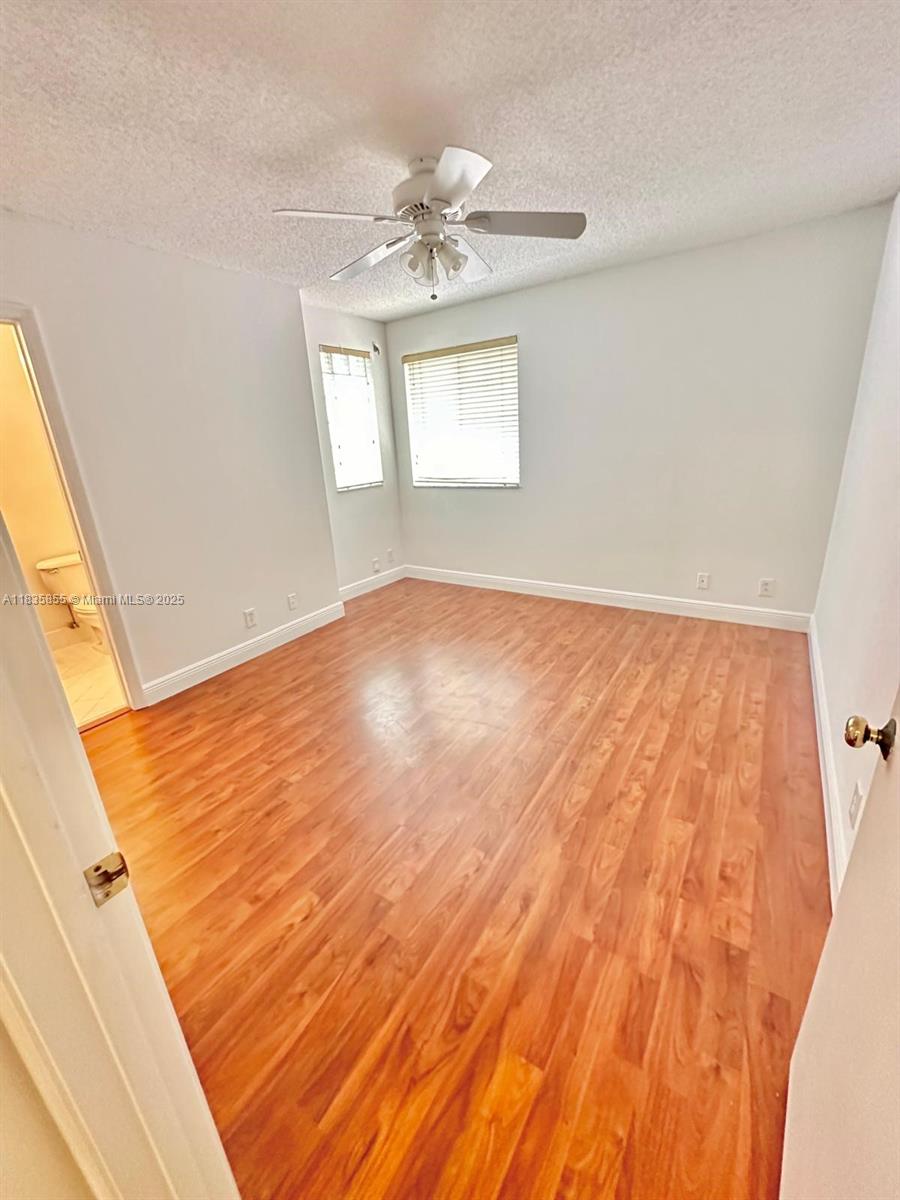 The Ridges Weston, FL 33331 - Photo 31 of 54 wooden floor in an empty room with a window