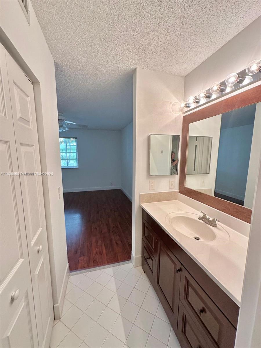 The Ridges Weston, FL 33331 - Photo 44 of 54 a bathroom with a sink a vanity and a mirror