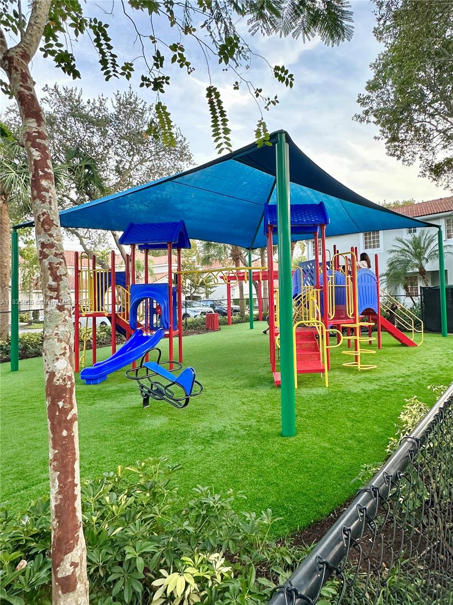 The Ridges Weston, FL 33331 - Photo 50 of 54 a view of an empty room with floor to ceiling windows and a yard