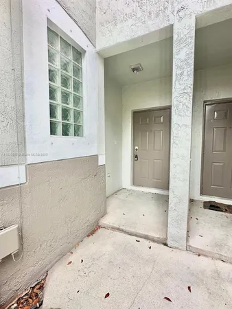 a view of a porch with a yard