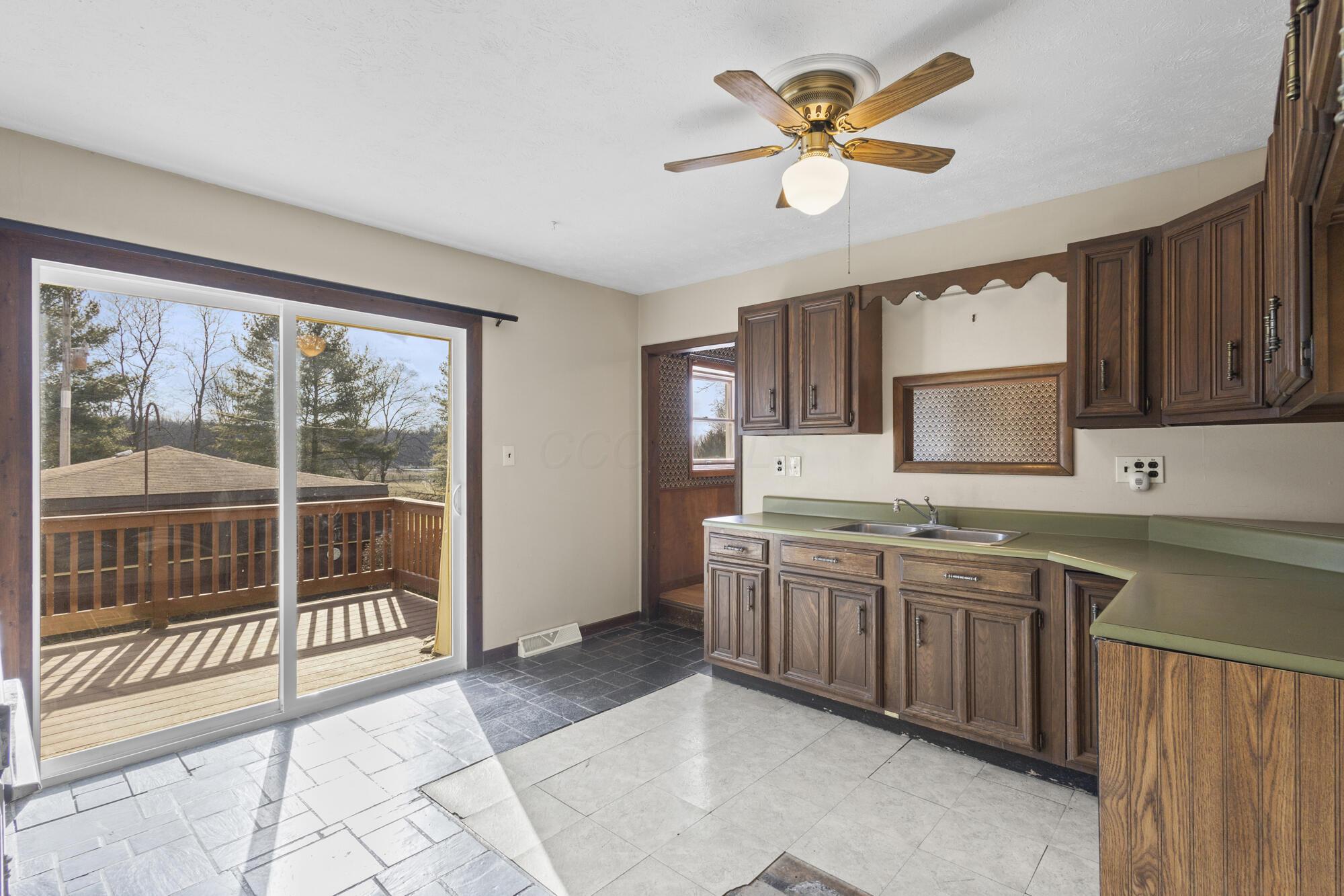 6650 Kilbourne Road Sunbury, OH 43074 - Photo 19 of 49 Kitchen leading out to deck