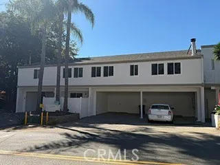 a front view of a house with a garage
