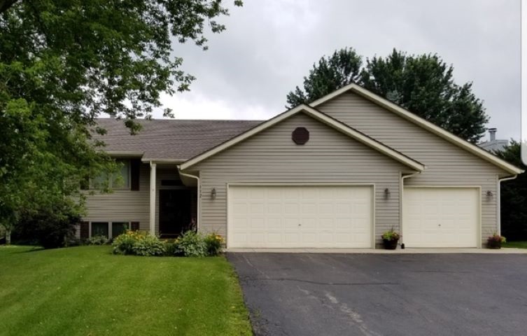 112 Pembroke Road Southwest Poplar Grove, IL 61065 - Photo 1 of 25 a view of backyard of house and garage