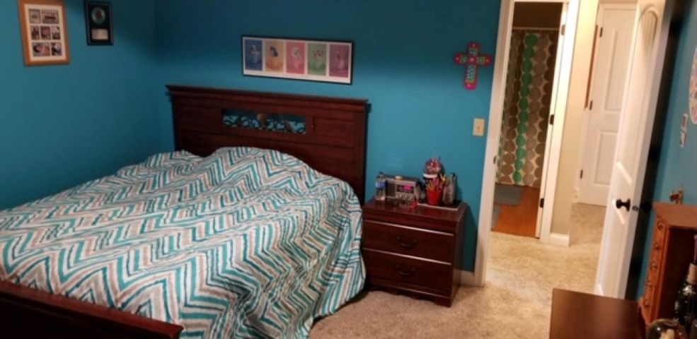 112 Pembroke Road Southwest Poplar Grove, IL 61065 - Photo 13 of 25 a bed sitting in a bedroom next to a window