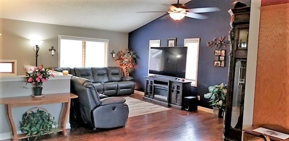 112 Pembroke Road Southwest Poplar Grove, IL 61065 - Photo 14 of 25 a living room with furniture and a flat screen tv