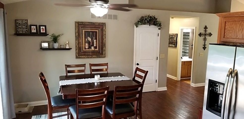 112 Pembroke Road Southwest Poplar Grove, IL 61065 - Photo 16 of 25 a view of a dining room with furniture and wooden floor