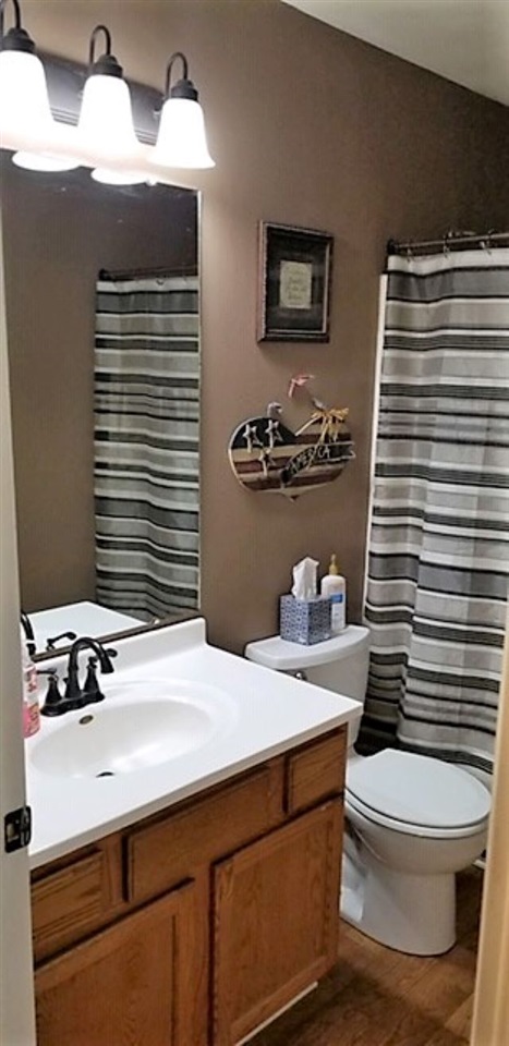 112 Pembroke Road Southwest Poplar Grove, IL 61065 - Photo 17 of 25 a bathroom with a sink a toilet and mirror