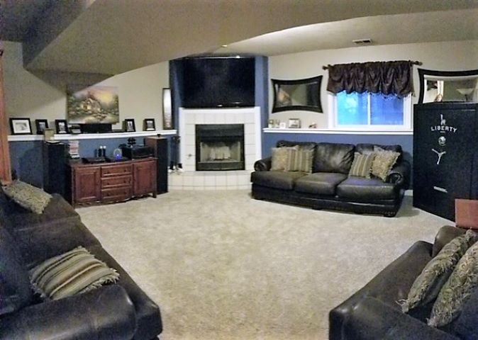 112 Pembroke Road Southwest Poplar Grove, IL 61065 - Photo 18 of 25 a living room with furniture and a fireplace