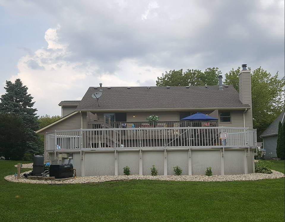 112 Pembroke Road Southwest Poplar Grove, IL 61065 - Photo 3 of 25 a front view of a house with a garden and yard