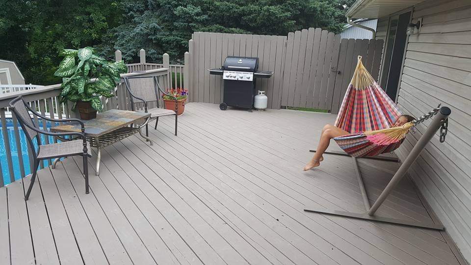 112 Pembroke Road Southwest Poplar Grove, IL 61065 - Photo 6 of 25 an outdoor sitting area with couch and wooden floor