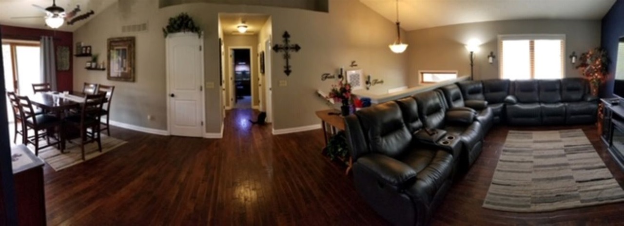 112 Pembroke Road Southwest Poplar Grove, IL 61065 - Photo 7 of 25 a view of a hallway with wooden floor and windows