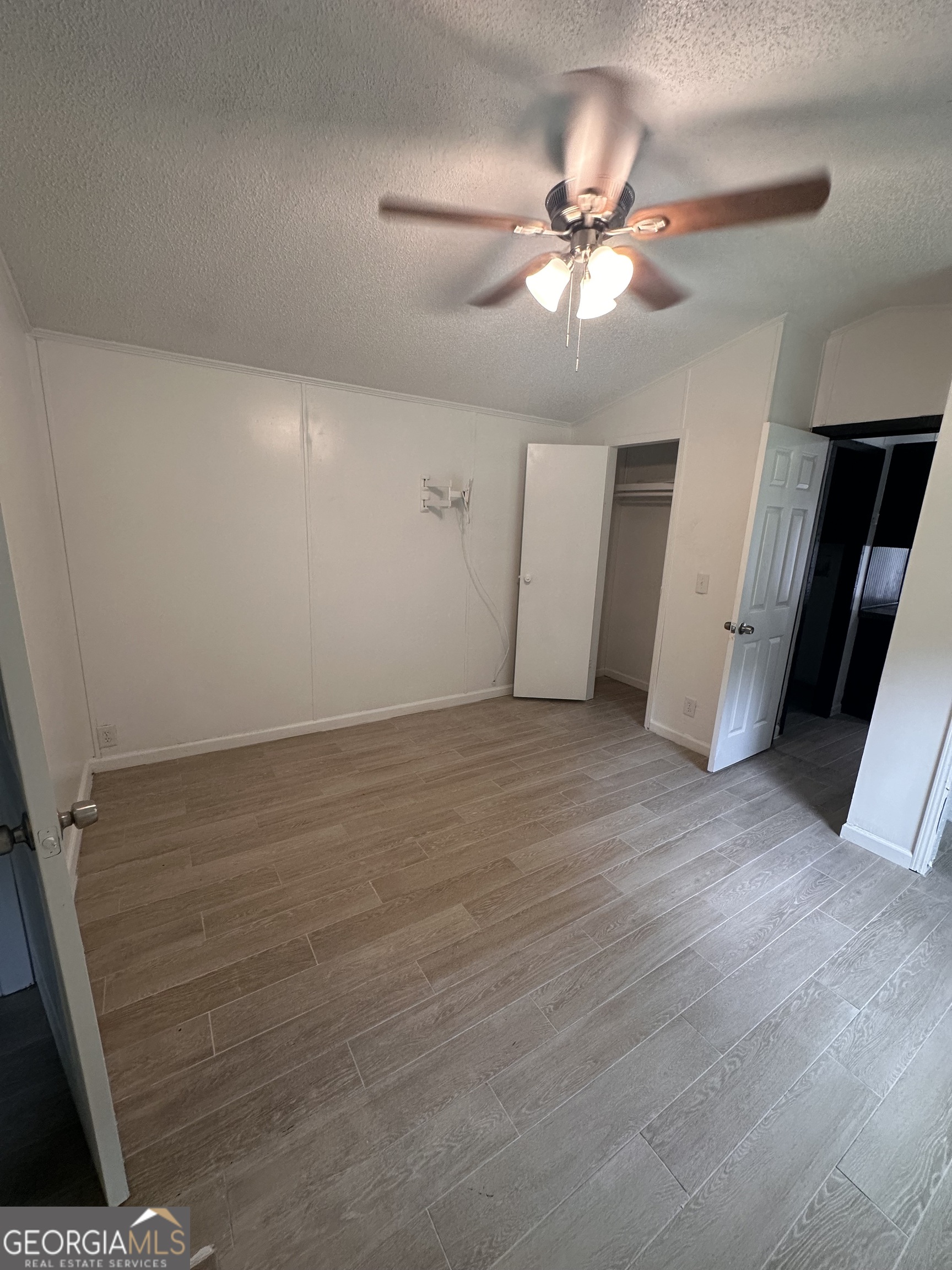 2023 Stephens Road Elberton, GA 30635 - Photo 17 of 21 wooden floor in an empty room with a window