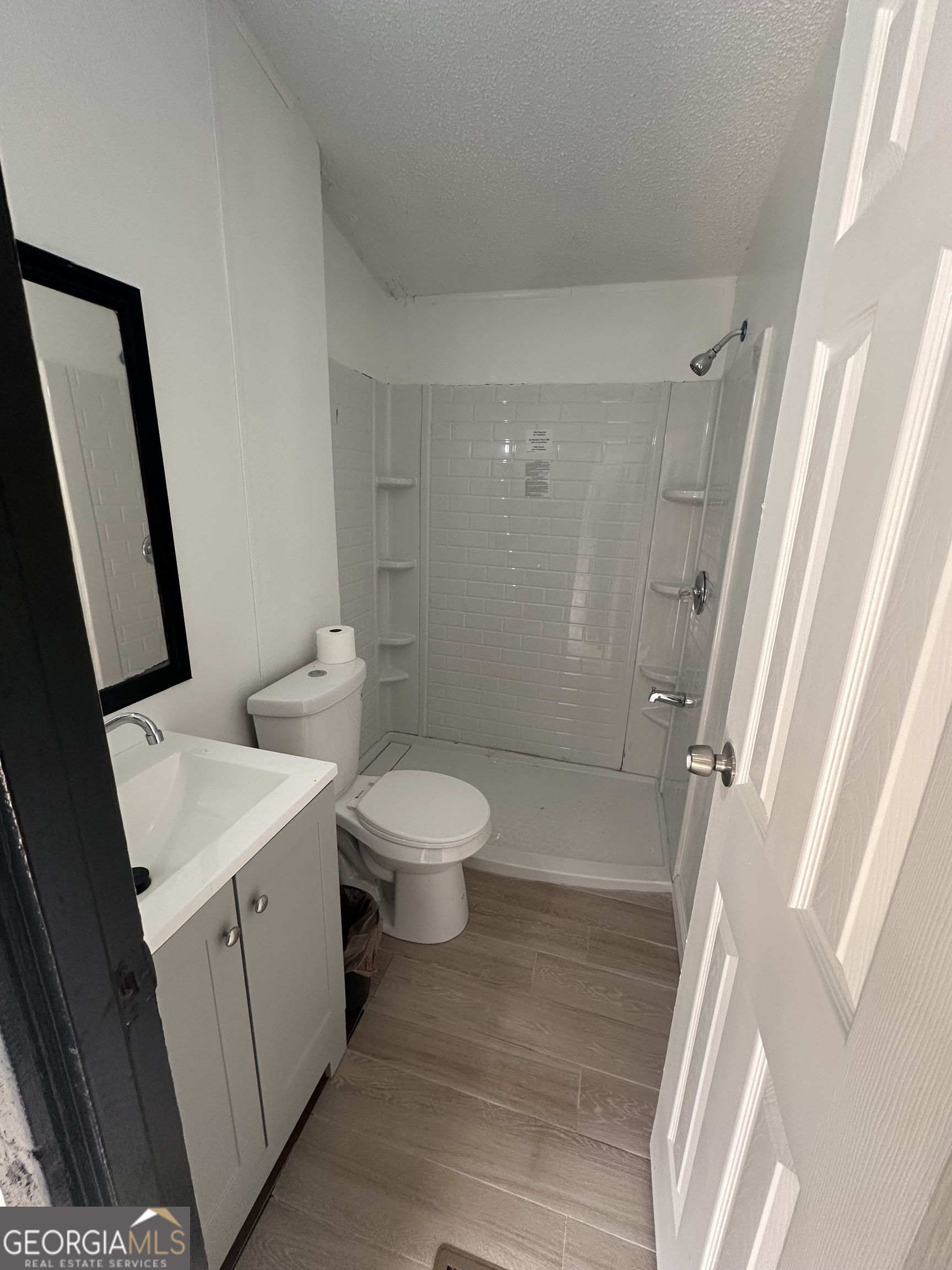 2023 Stephens Road Elberton, GA 30635 - Photo 19 of 21 a bathroom with a sink a toilet and shower