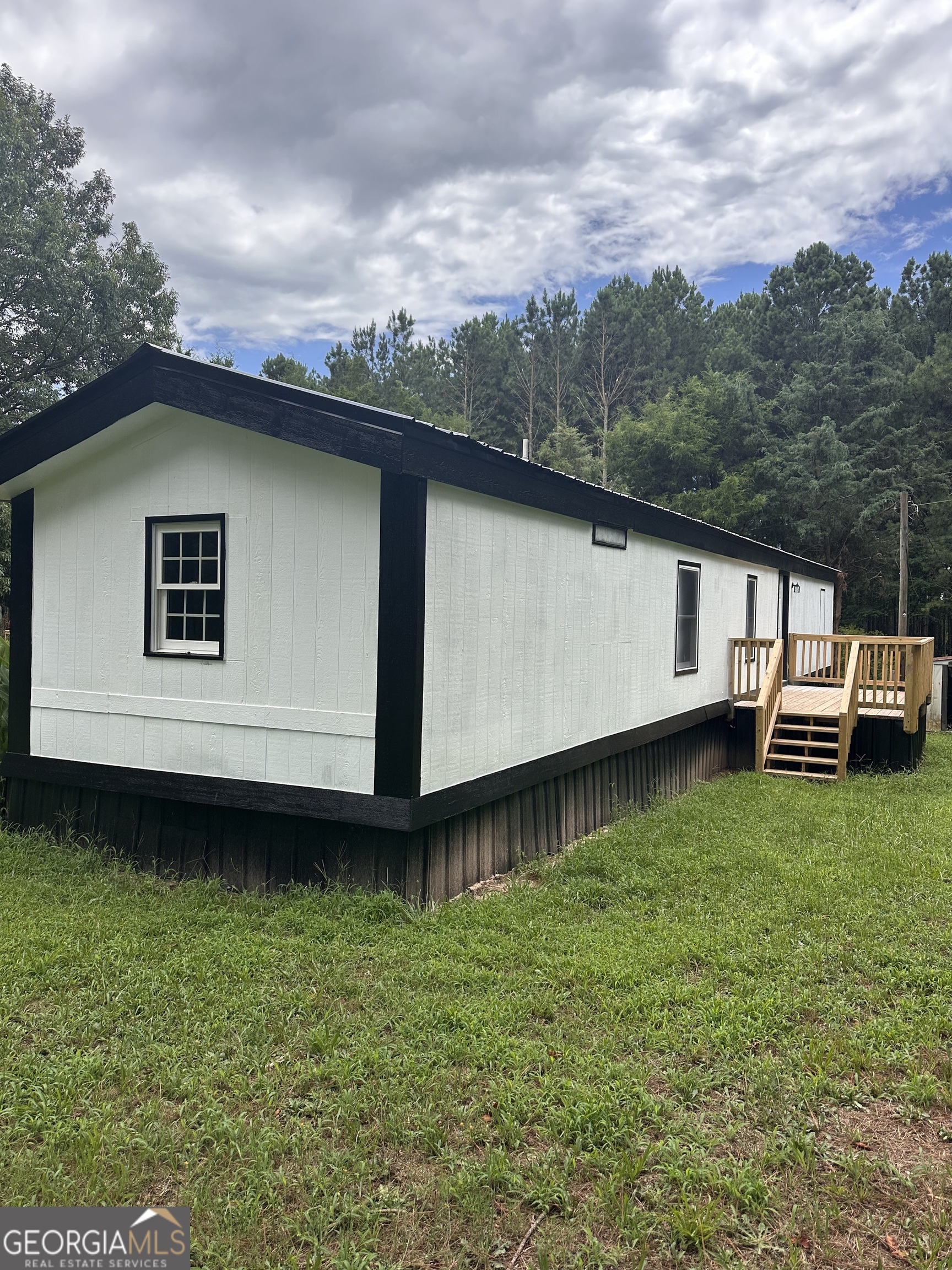 2023 Stephens Road Elberton, GA 30635 - Photo 2 of 21 a house view with a garden space