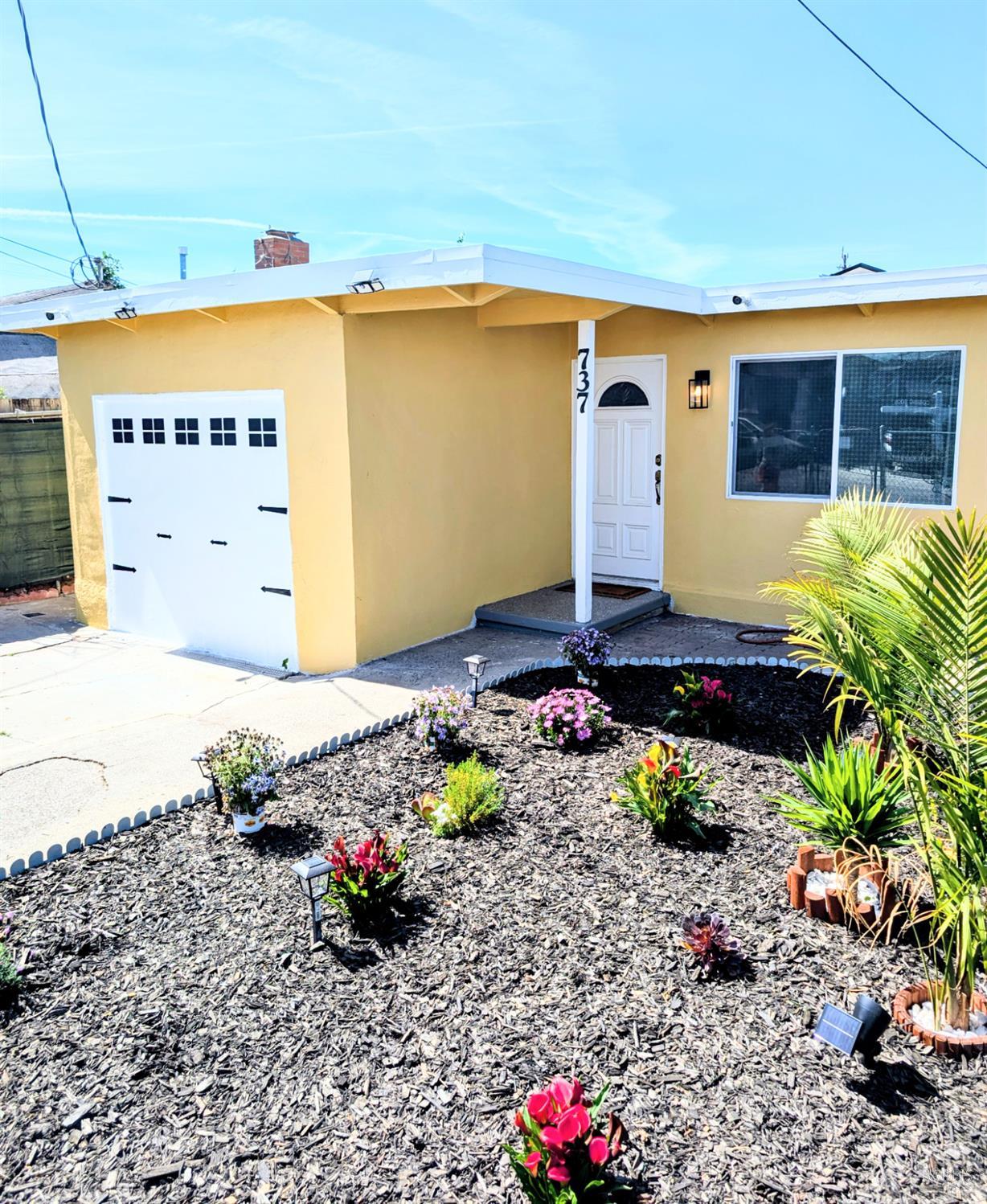 737 6th Street Richmond, CA 94801 - Photo 1 of 1 a front view of a house with a yard