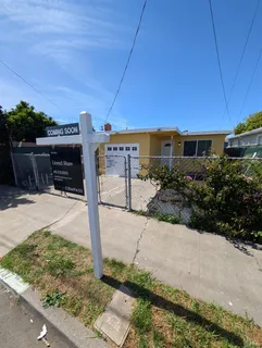 a kitchen with a stove and a refrigerator
