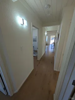 a white toilet sitting next to a bathroom sink