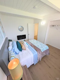 a bedroom with a bed and a couch